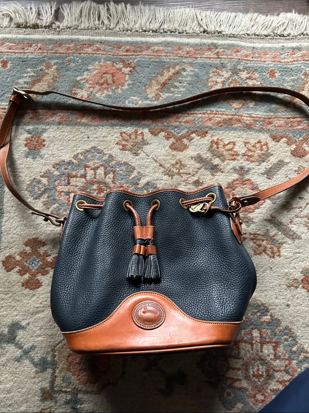 Dooney & Bourke Navy Pebble Leather Drawstring Bucket Bag with Tan Trim